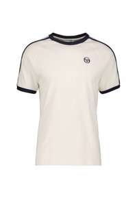 Krems krāsas īsām piedurknēm t-krekls ar tumši zilu apkakli un piedurknēm. Uz krūtīm ir mazs logo un raglanu dizains.