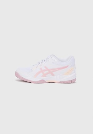 White athletic shoe with pink accents, featuring mesh panels, a textured sole, and a curved design. Notable branding on the side.
