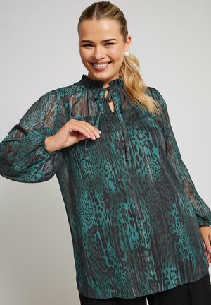 Sheer blouse in teal with a leopard-print pattern, mandarin collar, and tie closure, featuring long sleeves and textured accents.