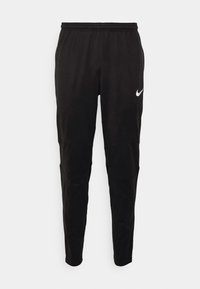 Schwarze Sporthose aus glattem Stoff mit einem elastischen Bund. Verfügt über Knie-Patches und einem weißen Nike-Logo auf der linken Seite.