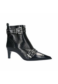 Black patent leather ankle boot with pointed toe, mid-heel, zip closure, and decorative buckle with grommets around the ankle.