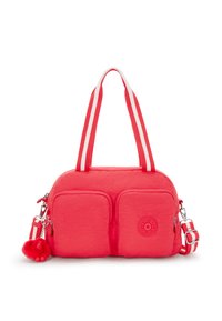 Röd mjuk materialväska med dubbla framfickor, vit och röd randiga handtag och en pälsig apa nyckelring som accent.