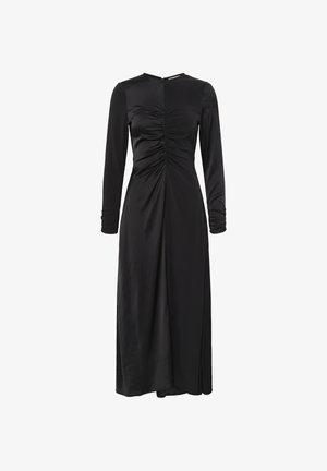 Melnas garām piedurknēm kleita ar rušēšanu pie krūšu daļas, augstu apkakli un plūstošu siluetu. Izgatavota no gluda, viegla auduma.