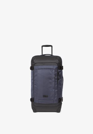 Marineblaue Rollreisetasche mit strukturiertem Stoffkörper, schwarzen Akzenten, ausziehbarem Griff, seitlichen Griffen und einer vorderen Reißverschlusstasche.