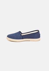 Blue canvas espadrille shoe with a jute rope sole, rounded toe, elasticized side trim, and minimal design.