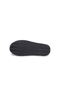 Black rubber shoe sole with a wavy texture, designed for traction. Features rounded edges and a flat base without detailing.