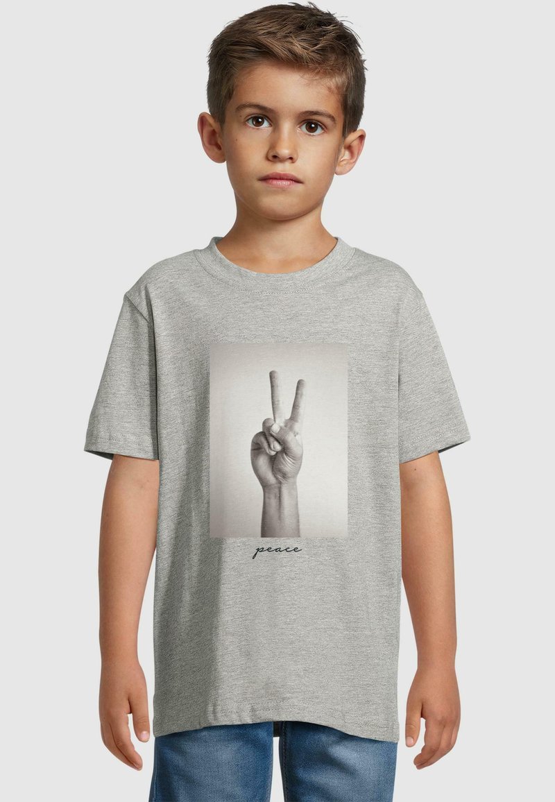 Gray cotton t-shirt featuring a black and white print of a hand making a peace sign, with the word "peace" printed below in cursive.