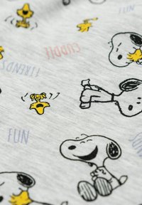 Light gray fabric featuring black outlines of Snoopy and Woodstock. Illustrations include playful poses and text accents like “FUN” and “CUDDLY.”