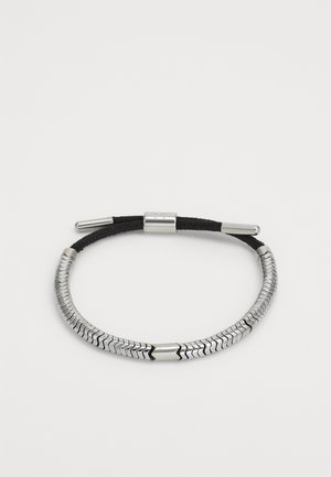 Black adjustable cord bracelet with segmented silver metal snake chain overlay and cylindrical silver metal clasp.
