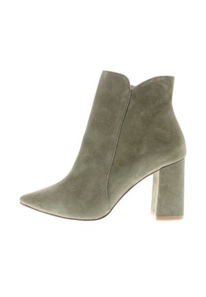 Olive green suede ankle boot with pointed toe and high block heel, featuring a subtle curved top edge.