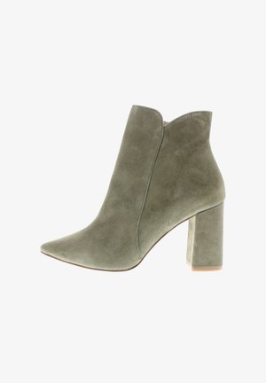 Olive green suede ankle boot with pointed toe and high block heel, featuring a subtle curved top edge.