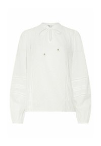 Blusa blanca de manga larga con cuello redondo, detalle de lazo, tela texturizada, sutiles lunares y costuras decorativas a lo largo de los lados.