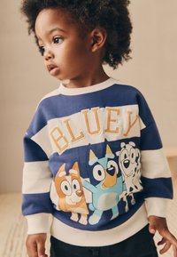 Felpa a righe blu e bianche con la scritta "BLUEY" in giallo, con cani dei cartoni animati dai colori vivaci. Tessuto morbido e design casual.