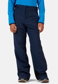 Laivaston lumihousut tasaisella vyötäröllä, joissa on kaksi nappia ja säädettävät sivuhihnat. Vahvistetut alaosat, joissa on sileä ja vettä hylkivä pinta.