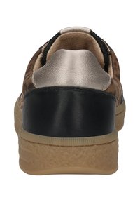 Rear view of a brown sneaker with black heel counter, metallic silver collar, beige padded lining, and textured light brown sole.