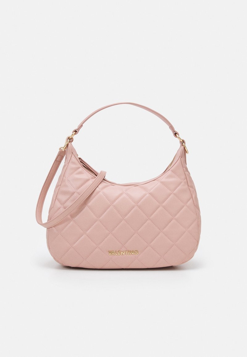 Quilted pink leather handbag with a curved shape, gold logo detail, and a detachable shoulder strap. Smooth texture and subtle sheen.