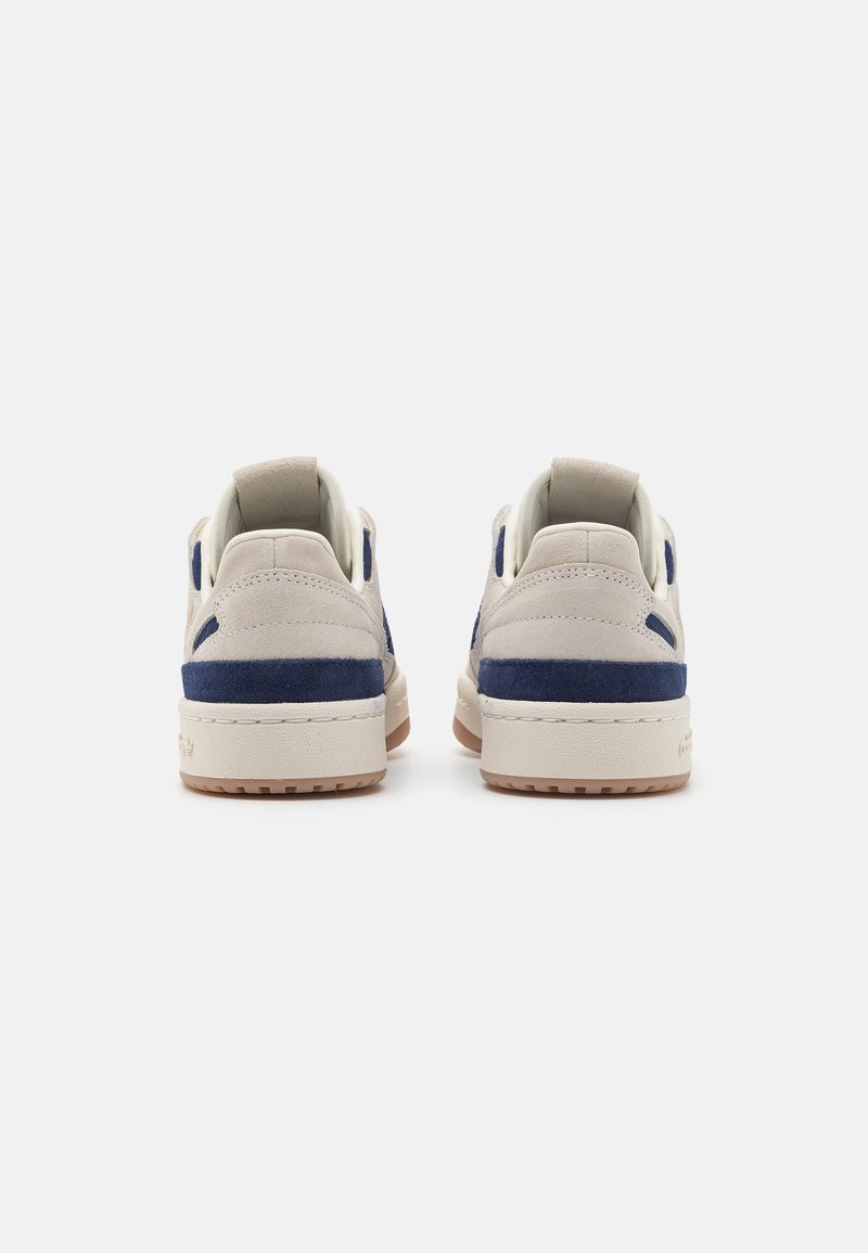 cream adidas forum blue and white