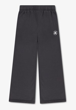Pantaloni grigio scuro a gamba larga con vita elasticizzata e logo bianco Converse All Star sulla parte superiore della coscia sinistra.