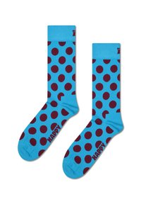 Blå sokker med store burgunderrøde prikker og ribbet kant. "HAPPY" logo trykt i burgunderrød på siden. Letvægts, komfortabelt stof.