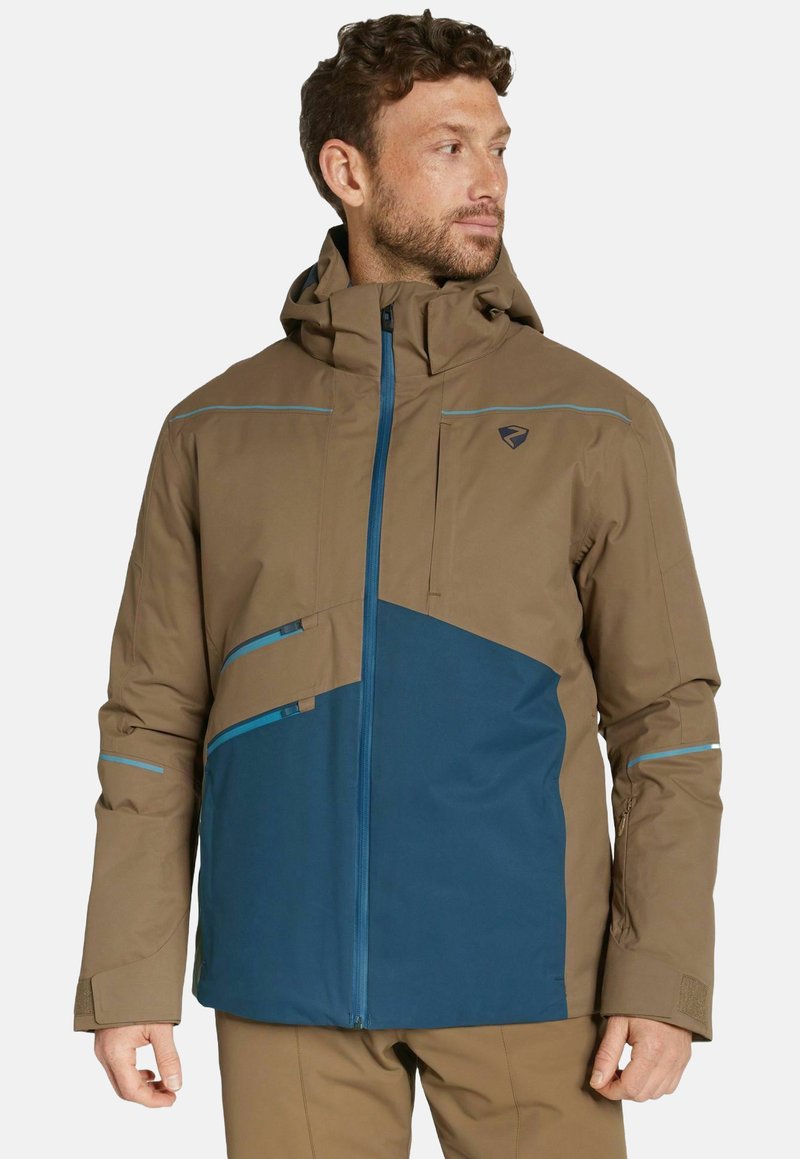 Veste marron et bleue dotée d'une capuche, d'une fermeture éclair à l'avant, de plusieurs poches zippées et de lignes d'accent bleu. Le matériau semble lisse et durable.