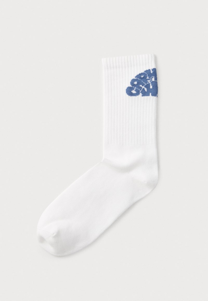 White cotton crew sock featuring ribbed texture and blue graphic text on the outer side, with a rounded toe and elasticized cuff.