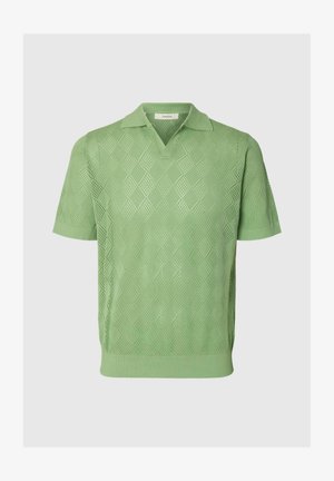 Polo in maglia verde chiaro a maniche corte con motivo traforato a rombi e collo, polsini e orlo a costine.