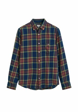 Geruiten overhemd in marineblauw, groen, geel en rood. Knopsluiting met kraag, lange mouwen en één enkele borstzak. Katoenen materiaal.