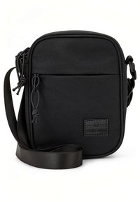 Compact black crossbody bag made of durable fabric. Features a zippered front pocket, adjustable strap, and a textured logo patch.