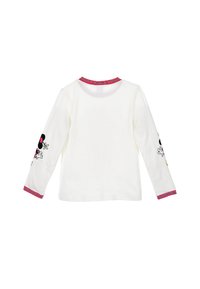 Camicia bianca a maniche lunghe con colletto a righe rosse e rosa. Design di personaggi ricamati neri e rossi su entrambe le maniche. Materiale in cotone morbido.
