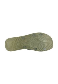 Soletta in gomma verde chiaro con scanalature testurizzate, forma arrotondata e quattro rilievi circolari. Presenta iscrizioni del marchio e del materiale.