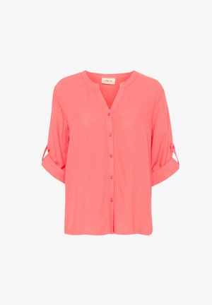 Coral, lightweight button-up shirt with a V-neck, roll-up sleeves, and a relaxed fit. Features a smooth texture and seven buttons down the front.