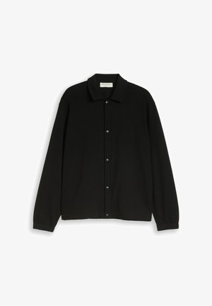 Black long-sleeve shirt jacket with collar and snap button closure, textured fabric, and fitted cuffs.