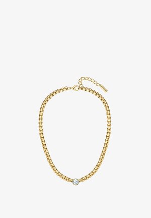 Zelta ķēdes kaklarota ar noapaļotiem posmiem un centrālo caurspīdīgu kristāla akcentu. Regulējama aizdare ar nelielu pagarinājumu izmēra pielāgošanai.