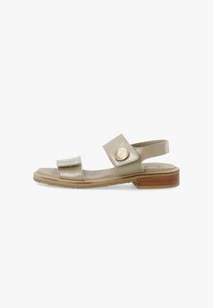 Gold leather sandal with an open toe, two adjustable straps, and a round metal accent, featuring a low wooden block heel.