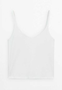 Hvid ærmeløs camisole med tynde stropper og V-halsudskæring, lagt fladt på en hvid baggrund.