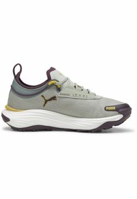 Sport sneaker with a mesh upper in light gray, purple accents, and a thick white midsole. Features rounded toe and textured tread pattern.