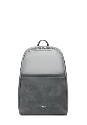 Gray backpack with a smooth faux leather bottom and a textured fabric top, featuring a zip closure, padded straps, and a front pocket.