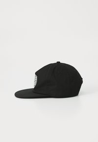 Black baseball cap with a rigid brim, featuring an embroidered graphic on the side. Made of fabric, showcasing a smooth texture.