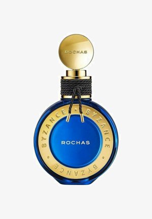 Sininen lasinen hajuvettä pullo, jossa on pyöreä muoto, kultainen korkki ja kultaiset yksityiskohdat, joissa lukee "ROCHAS BYZANCE" pohjan ympärillä.