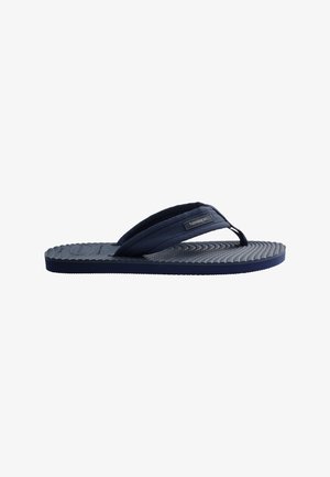 Mørkeblå flip-flop med polstret tekstureret fodseng og bredt stof-tårem med lille mærkelabel.