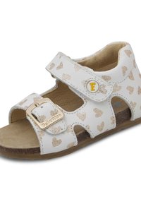Sandalo in pelle bianca con motivo a cuore dorato, cinturino regolabile con fibbia dorata, design open toe e soletta testurizzata.