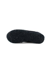 Black rubber shoe sole with wavy texture, circular pattern accents, and logo placement. Features non-slip tread for traction.