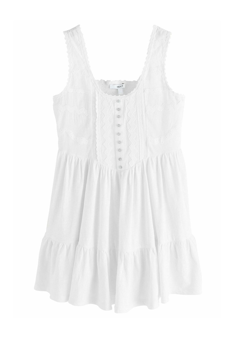 Witte mouwloze dress met een ronde hals, knoopsluiting aan de voorkant, getextureerde corsage en een uitlopende rok met een ruchesrand.