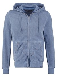 Felpa con cappuccio azzurro chiaro con zip, coulisse sul cappuccio, tasche frontali e impunture a contrasto. Realizzata in tessuto morbido con una finitura texturizzata.