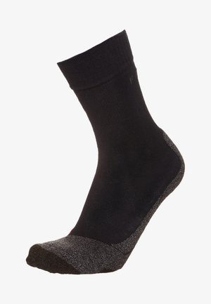 Calzino nero con bordo a costine, tacco e punta rinforzati in grigio, realizzato in un materiale liscio con una leggera lucentezza e texture durevole.