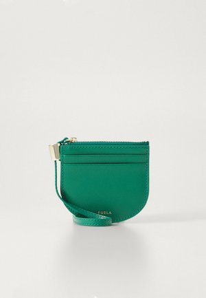Green leather cardholder with a rounded shape, zip closure, front slots for cards, and a detachable strap. Gold hardware accents.