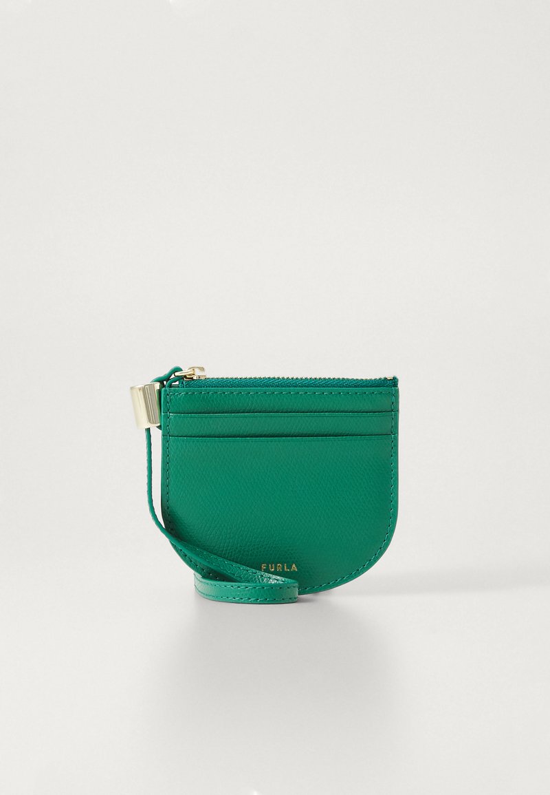 Green leather cardholder with a rounded shape, zip closure, front slots for cards, and a detachable strap. Gold hardware accents.