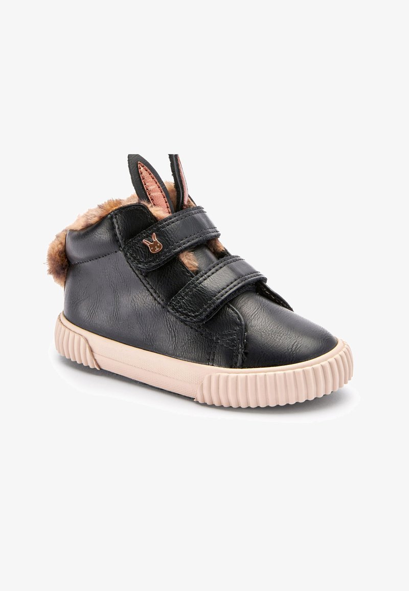Black leather high-top shoe with two Velcro straps, beige rubber sole, faux fur trim, and rabbit-shaped metal accent on the side.