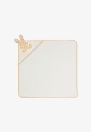 Rechthoekige babydeken van zacht witte stof, met een beige satijnen hoek met konijnenoren en een lichtbruine konijnsilhouet.