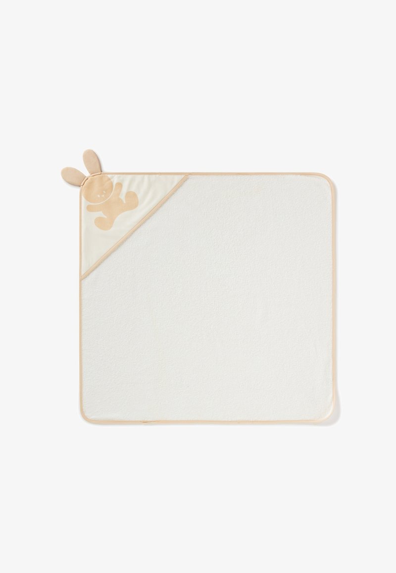 Coperta rettangolare per neonati in morbido tessuto bianco, con un angolo in raso beige decorato con orecchie di coniglio e una silhouette di coniglio marrone chiaro.